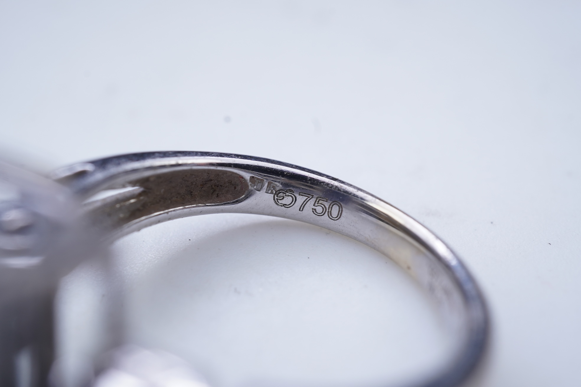 An iolite and diamond ring